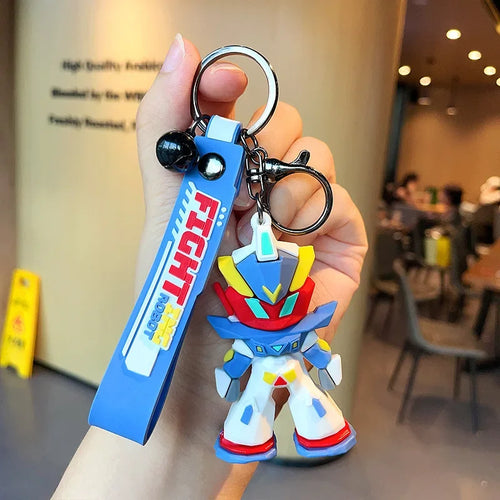 Porte-clés figurine robot de style manga coloré, design bleu et rouge, tenu en main – Transformers.
