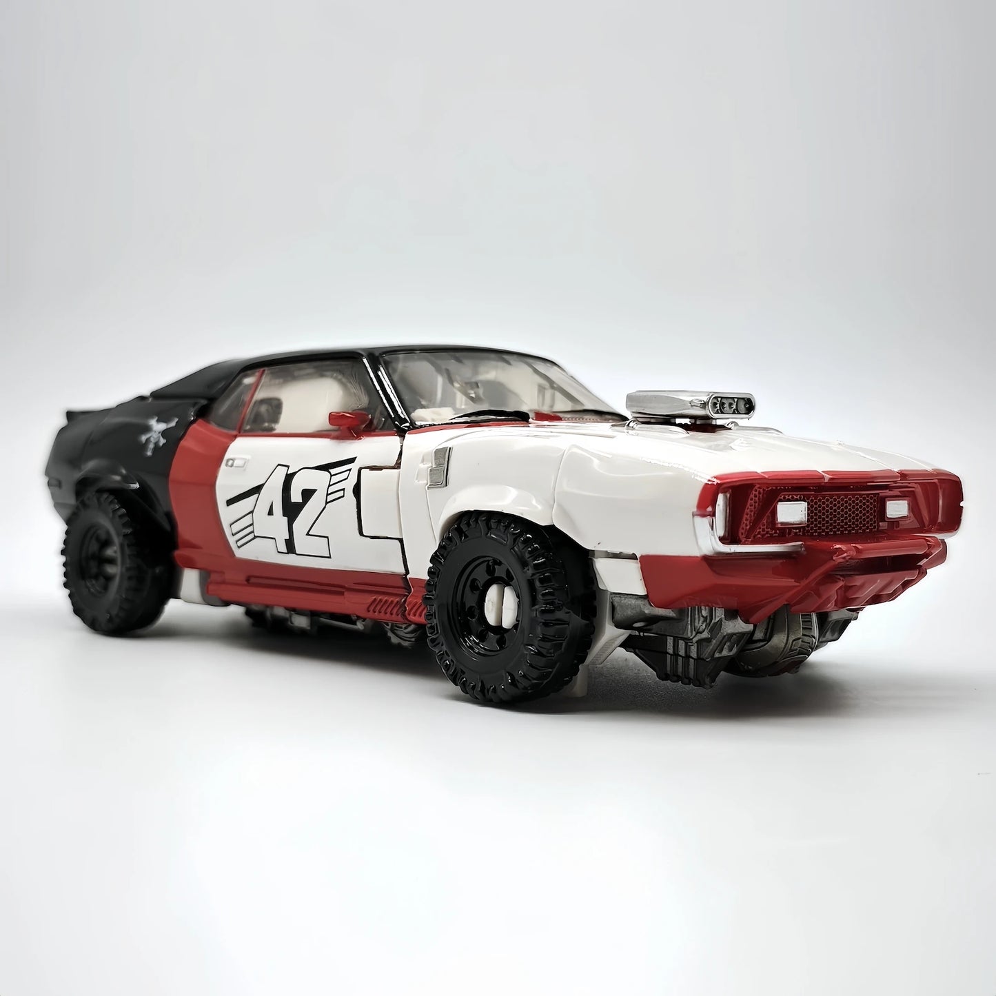 Figura Transformers Dropkick Rojo TW1033B — Decepticon Coche Articulado