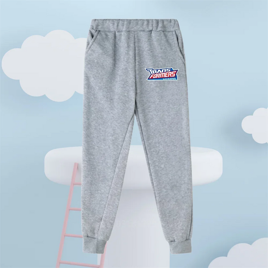Pantalon de jogging gris enfant avec logo Transformers, fond bleu ciel nuages – Transformers.